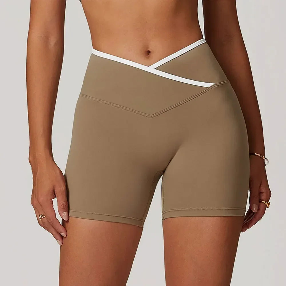 mocha Front view of women’s crossover high-waisted shorts featuring a slimming V-waist design - BetterPlace