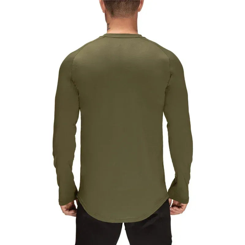 Person wearing an olive green long-sleeve shirt on a white background