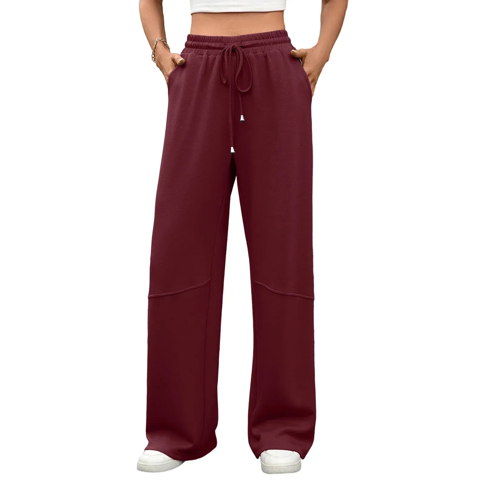 Maroon wide-leg pants worn by a person on a white background