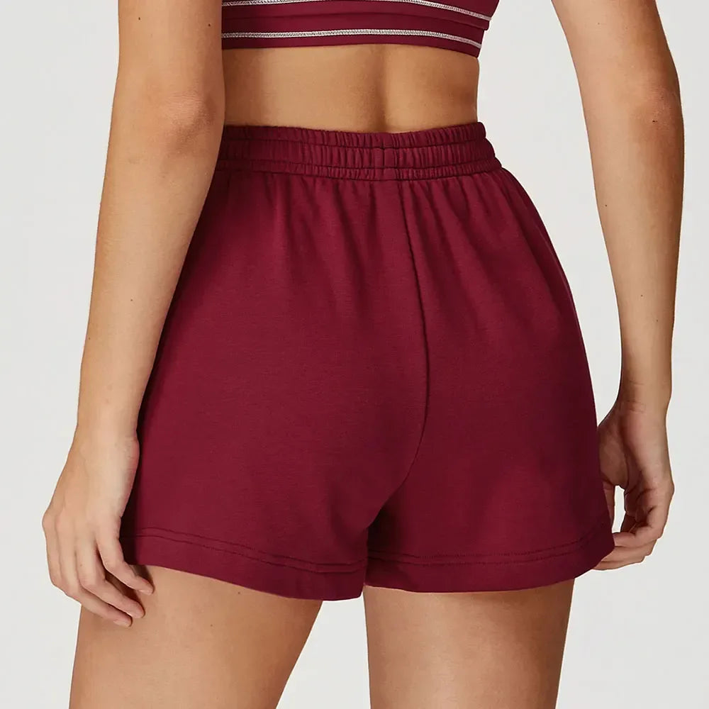 Red Back view of high-rise loose fit workout shorts highlighting the relaxed leg and secure waistband - BetterPlace