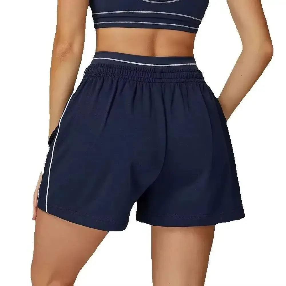 royal blue Back view of high-rise loose fit workout shorts highlighting the relaxed leg and secure waistband - BetterPlace