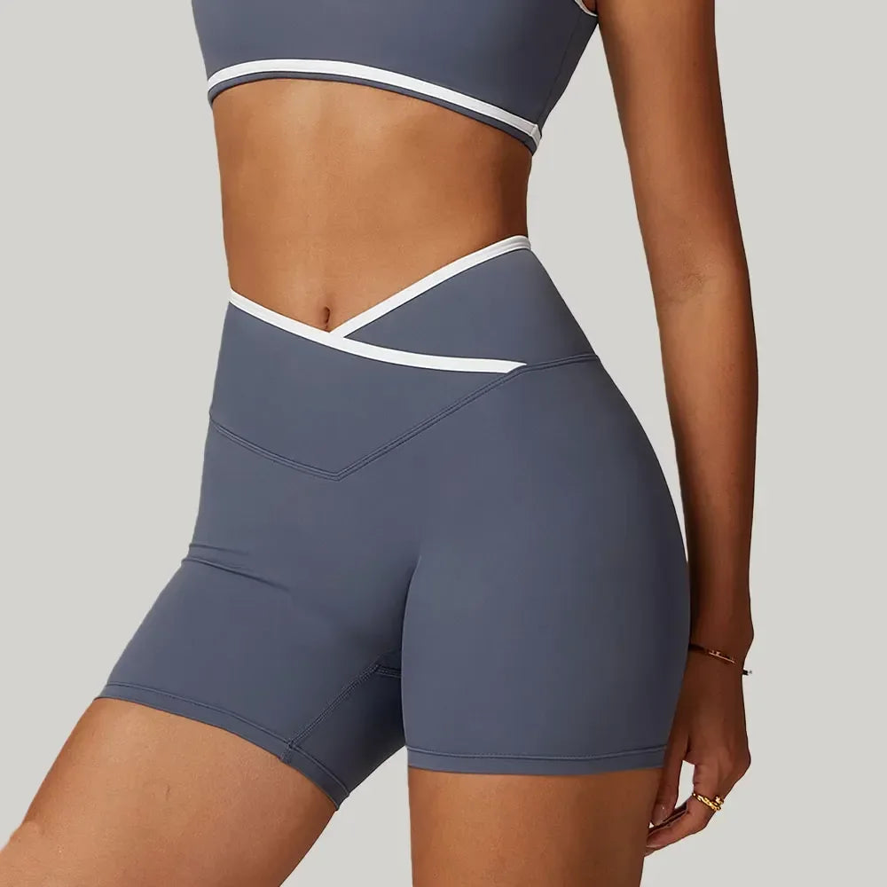 royal blue Side view of women’s crossover high-waisted shorts showing the seamless pocket construction and athletic compression fit - BetterPlace