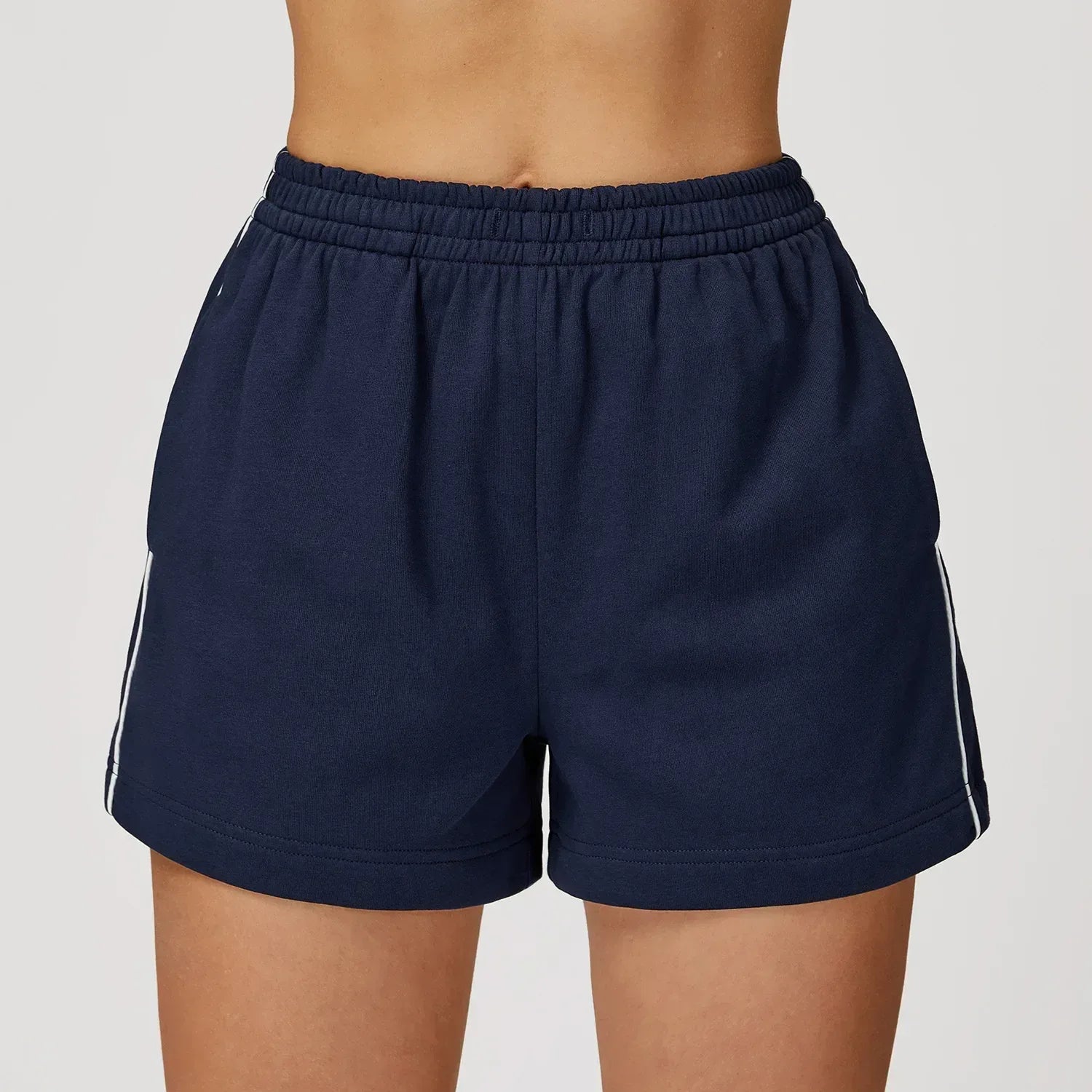 royal blue Front view of women’s high-waisted loose pocket shorts in a breathable athletic fabric - BetterPlace