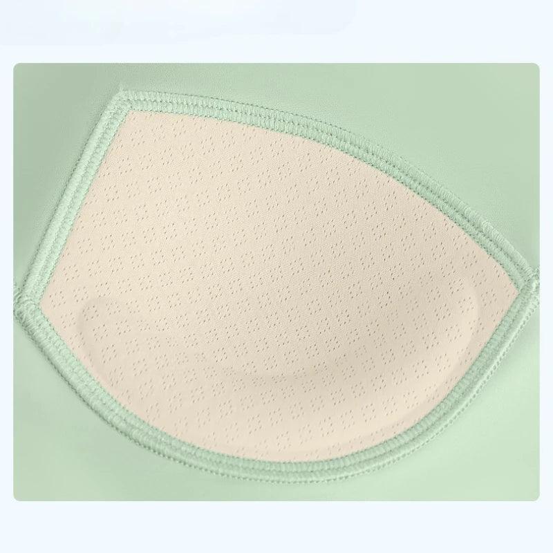 Green and beige fabric patch on a light green background
