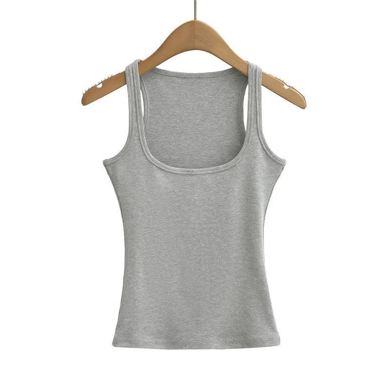 Gray tank top on a wooden hanger against a white background