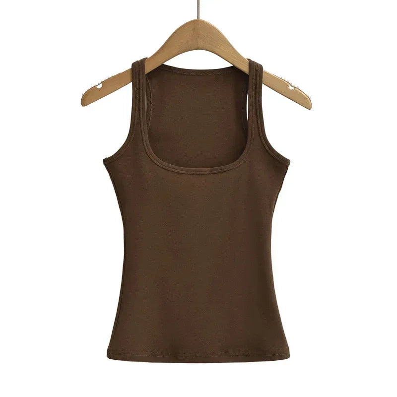 Brown tank top on a wooden hanger against a white background