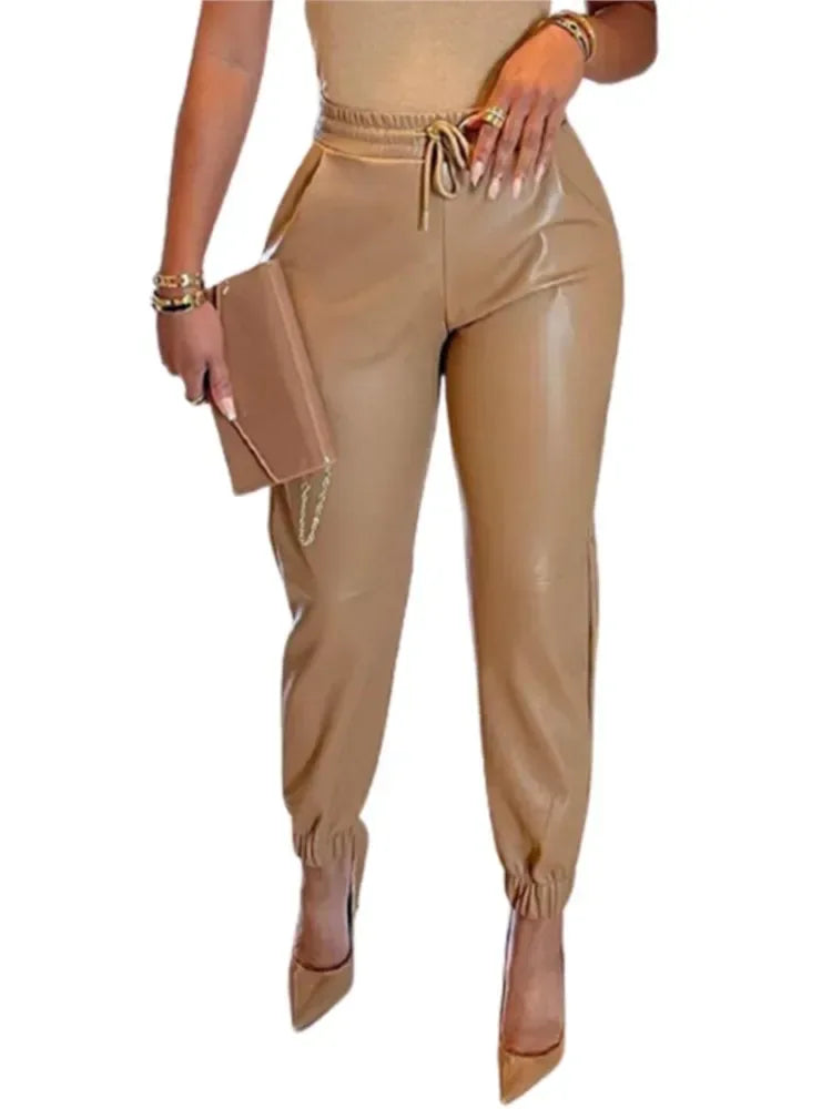 Beige jumpsuit with matching handbag on a white background