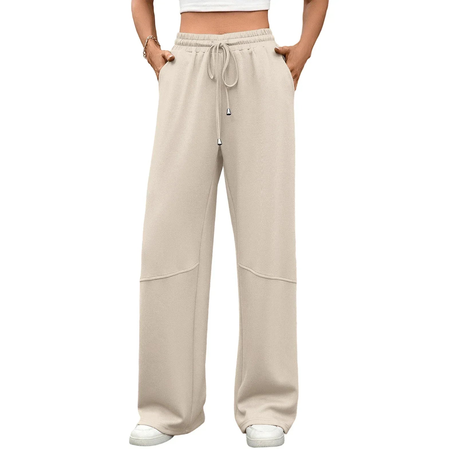 Beige wide-leg pants worn by a person on a white background