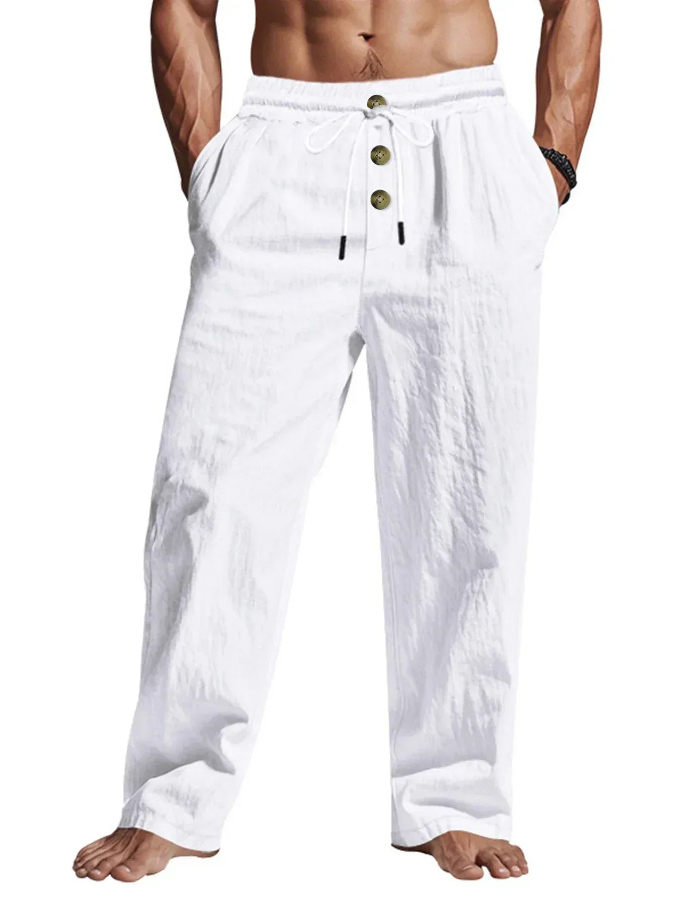 White linen pants with button details worn by a person on a white background