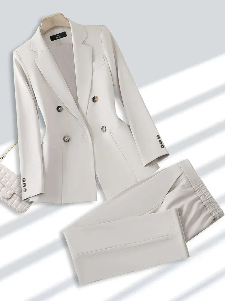 white suit jacket and pants on a light background